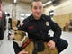 Tyler Van Leer of the Millville Fire Department and Hansel pose for a photo on Tuesday. Hansel will be the first pit bull in the United States certified in arson detection, according to Throw Away Dogs Project.