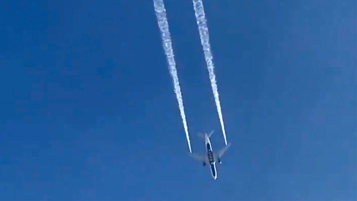In this image from video, Delta Air Lines Flight 89 to Shanghai, China dumps fuel over Los Angeles before returning to Los Angeles International Airport for an emergency landing Tuesday, Jan. 14, 2020. Fire officials say fuel apparently dumped by the aircraft returning to LAX fell onto an elementary school playground.