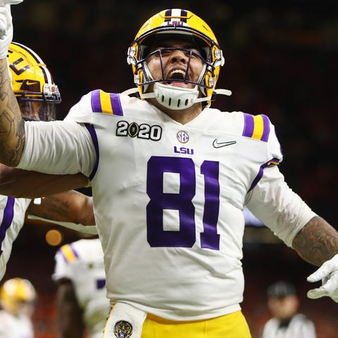 LSU Tigers tight end Thaddeus Moss celebrates afte