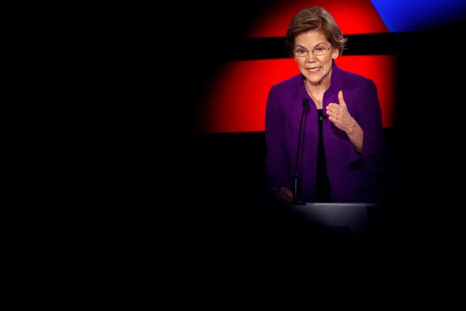 Democratic presidential candidate Sen. Elizabeth Warren, D-Mass., answers a question Tuesday, Jan. 14, 2020, during a Democratic presidential primary debate hosted by CNN and the Des Moines Register in Des Moines, Iowa.