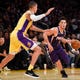 Phoenix Suns guard Devin Booker (1) drives the ball defended by Los Angeles Lakers forward Kyle Kuzma (0) during the third quarter at Staples Center in a 2017 game.