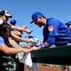 Chicago Cubs third baseman Kris Bryant (17) sings autographs for fans prior to the game against the Arizona Diamondbacks at Sloan Park last February.