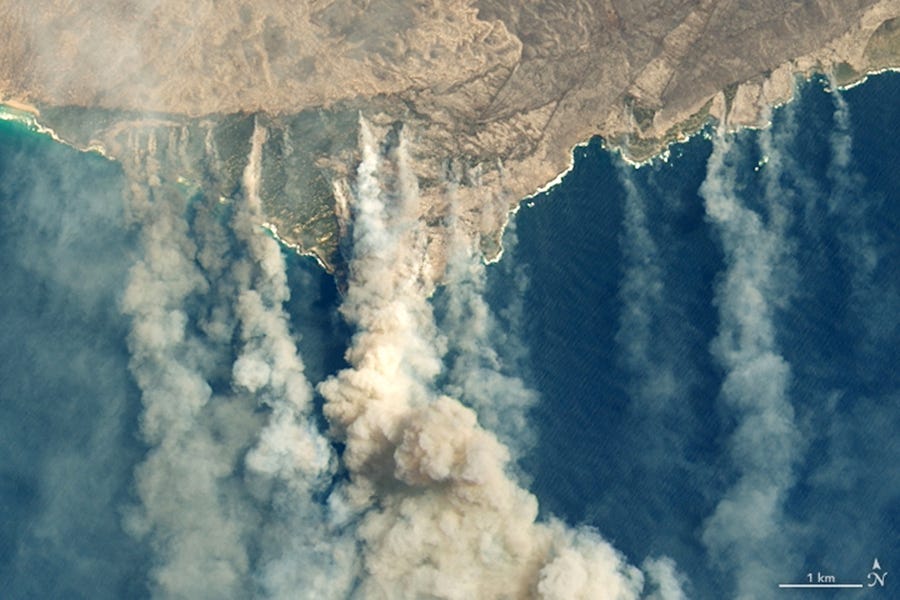 A handout photo made available by NASA Earth Observatory of a satellite image showing burned land and thick smoke over Kangaroo Island, Australia, 09 January 2020.