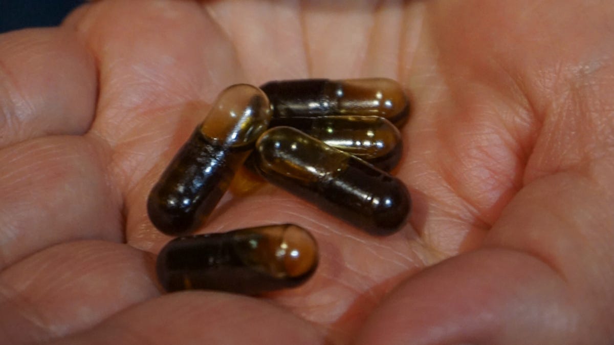 Jeanette Hales holds the CBD tablets she was taking. She has stopped using the product after the positive test results.