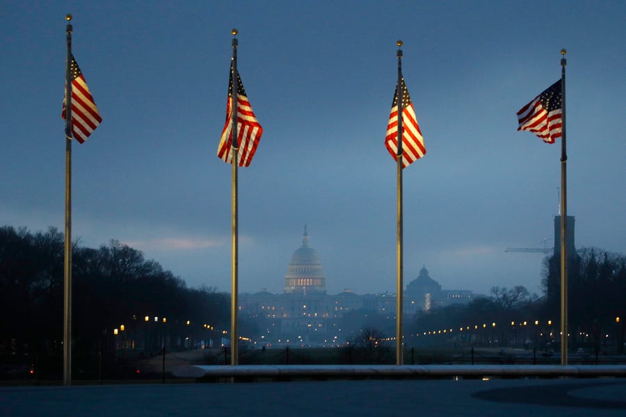 The Capitol, seen from the base of the Washington Monument, is shrouded in fog on Jan. 15, 2020. Lawmakers are set to start the impeachment trail of President Donald Trump.