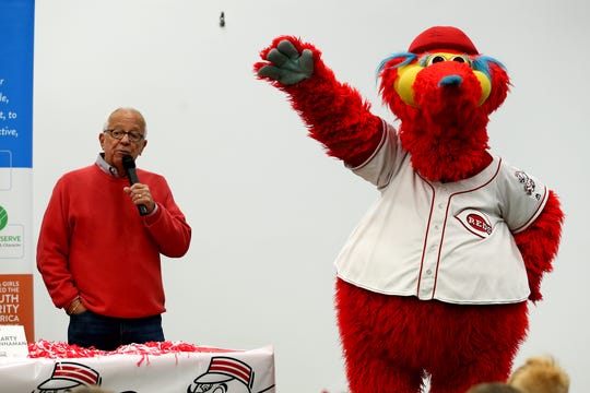 Former Cincinnati Reds Hall of Fame broadcaster Marty Brennaman and mascot Gapper, say hello to the children during a Reds Caravan stop, Thursday, Jan. 16, 2020, at the Boys & Girls Club of Clermont County. 