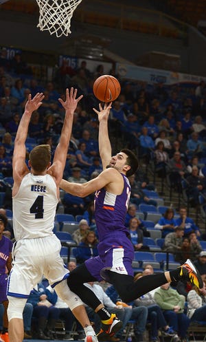 Evansville's Sam Cunliffe shoots an off-balance shot and misses in the first half of the Purple Aces' game against the host Indiana State Sycamores on Wednesday. 