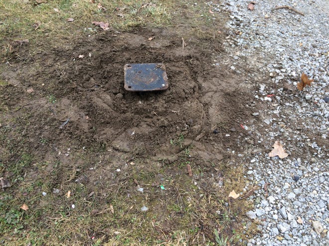 A trash container is no longer connected to its base after an explosion in Glen Miller Park.