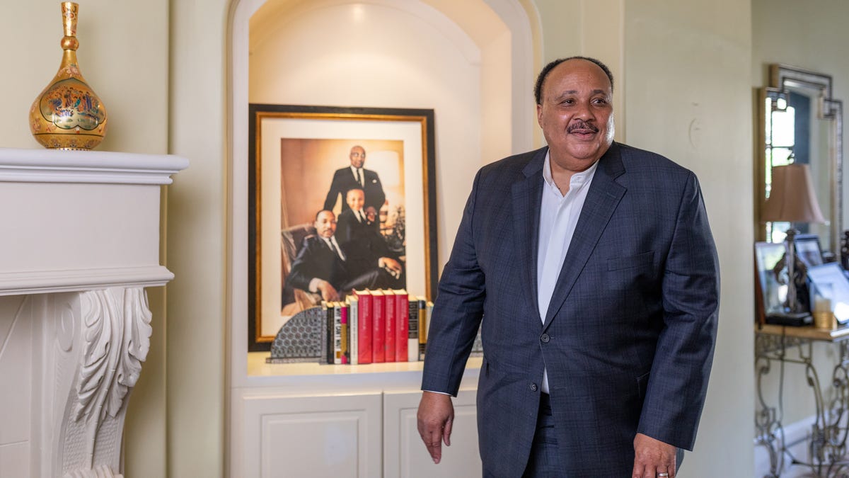 Martin Luther King III stands in front of a portrait of him and his father, Martin Luther King, Jr., in his Atlanta home on Jan. 9, 2020. As the holiday celebrating Martin Luther King Jr. approaches on Jan. 20, his son talked about the importance of keeping his legacy alive. At a time when the country still struggles with racism and white supremacy, King III continues to build on his father's dream and the fight for equality.