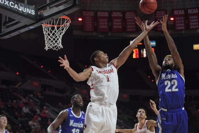 UL's Jalen Johnson (1) battles TiAndre Jackson-Young (22) for the ball in Thurday's loss to UTA.