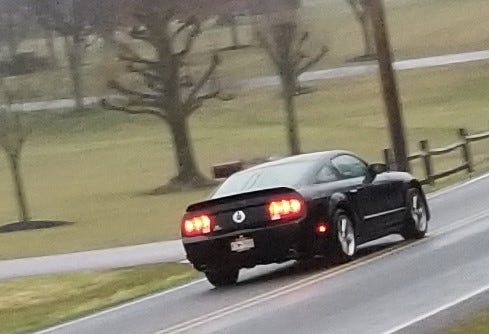 Do you know the driver of this black Mustang?