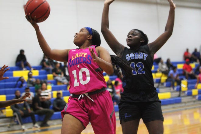 Rickards senior Ne'aysia Randall goes up and under for a layup as the Raiders' girls basketball team beat Godby 55-43 on Jan. 16, 2020.