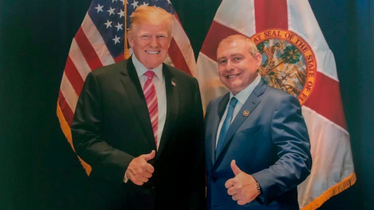 This undated image released by the House Judiciary Committee from documents provided by Lev Parnas to the committee in the impeachment probe against President Donald Trump, shows a photo of Lev Parnas with Trump in Florida. Parnas, a close associate of Trump's personal lawyer Rudy Giuliani is claiming Trump was directly involved in the effort to pressure Ukraine to investigate Democratic rival Joe Biden. Trump on Thursday, Jan. 16, 2020, repeated   denials that he is acquainted with Parnas, despite numerous photos that have emerged of the two men together. (House Judiciary Committee via AP) ORG XMIT: WX110