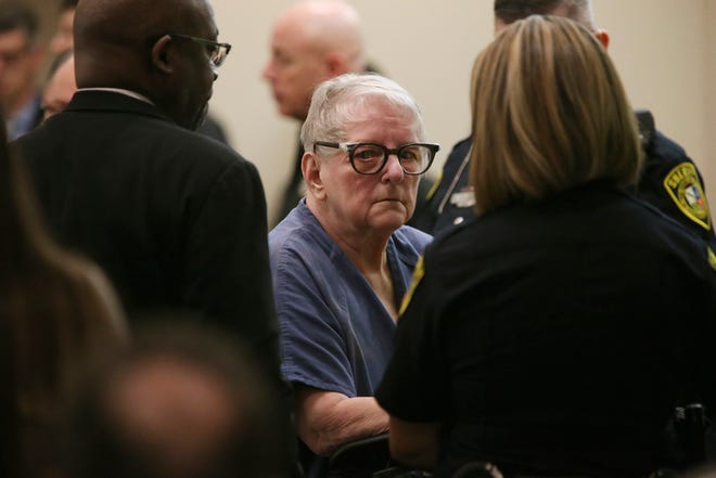 Genene Jones is escorted out of the Bexar County court in San Antonio, Jan. 16, 2020. The former Texas nurse suspected in the killing of dozens of children pleaded guilty in the 1981 death of an 11-month-old boy, receiving a life sentence that a prosecutor said should ensure she dies in prison.