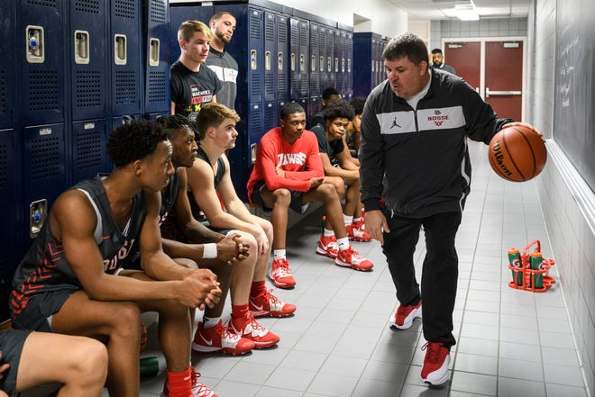 Bosse Coach Shane Burkhart, right, talks to his team during halftime of the Banterra Bank SIAC Tournament semifinal against the Reitz Panthers at Reitz High School in Evansville, Ind., Friday, Jan. 17, 2020. The Bosse Bulldogs defeated the Reitz Panthers, 93-73.