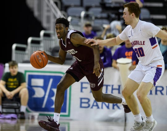 Missouri State's Keandre Cook (1) dribbles around Evansville's Noah Frederking (30) during the second half at Ford Center in Evansville, Ind., Saturday, Jan. 18, 2020. The Purple Aces fell 68-58 to the Bears.