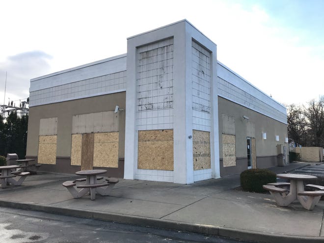 The building that formerly housed a KFC restaurant, at the corner of U.S. 41 and Covert Avenue, has been boarded up with all KFC signage removed. A piece of copy paper taped to the door reads simply "Permanently closed."