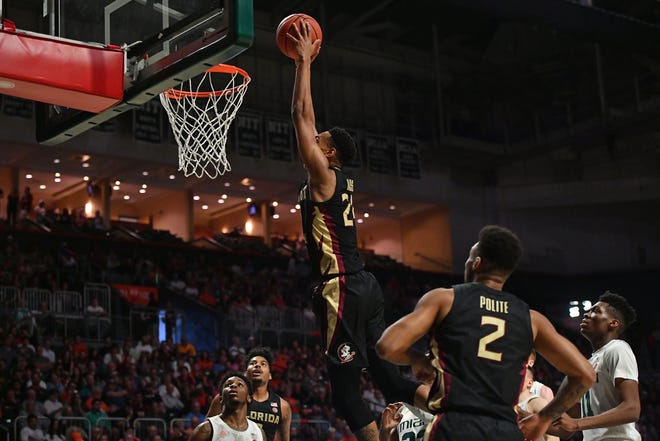 Jan 18, 2020; Coral Gables, Florida, USA; Florida State Seminoles guard Devin Vassell (24) dunks the ball against the Miami Hurricanes during the first half at Watsco Center. Mandatory Credit: Jasen Vinlove-USA TODAY Sports