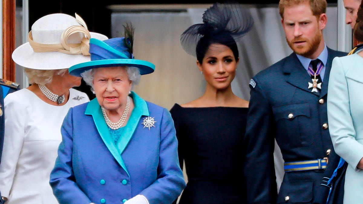 Duchess of Cornwall, Britain's Queen Elizabeth II, Britain's Meghan, Duchess of Sussex, Britain's Prince Harry, Duke of Sussex, and Britain's Prince William, Duke of Cambridge come onto the balcony of Buckingham Palace.
