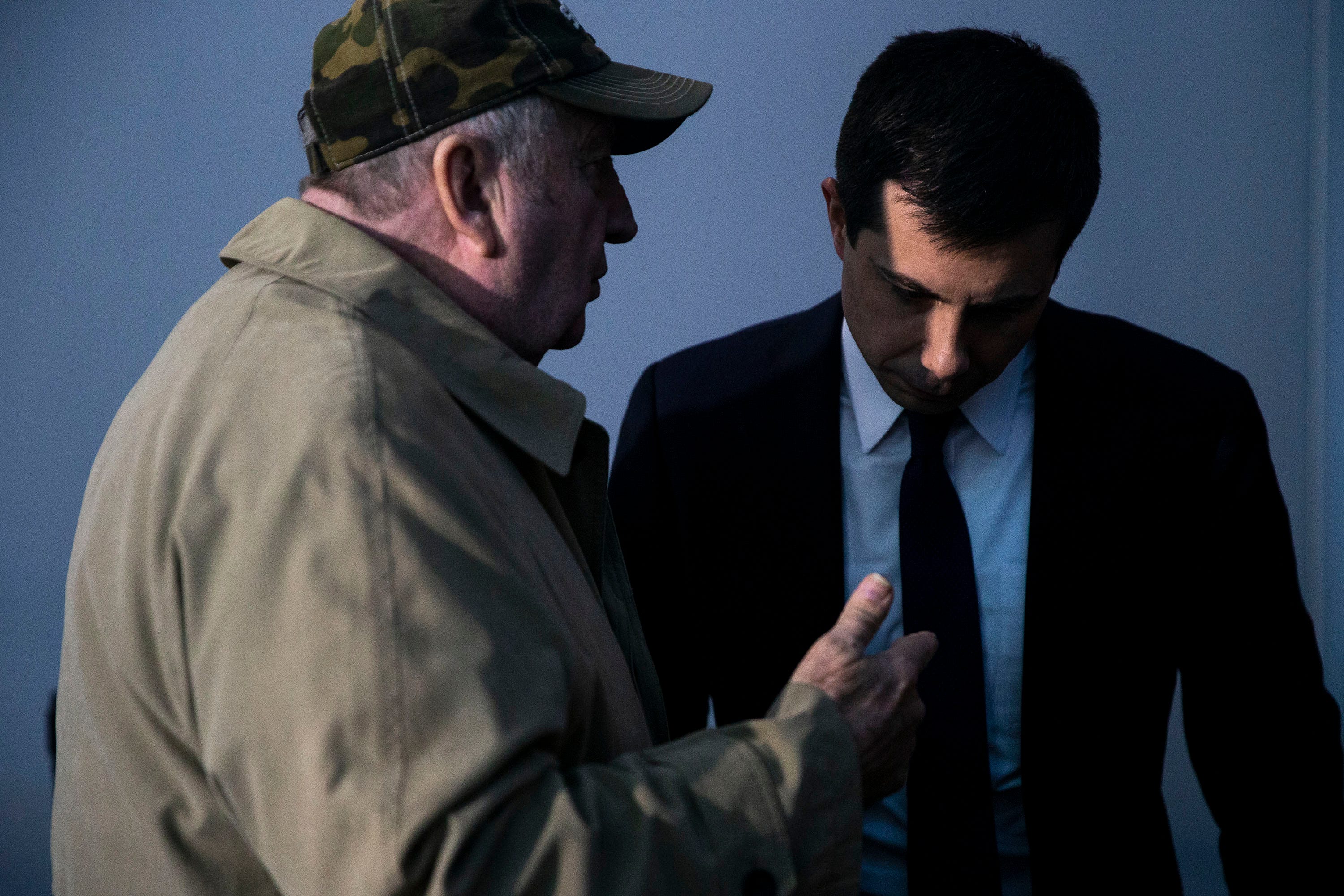 3:38 p.m., Harlan — Pete Buttigieg speaks with a man in the crowd after a town hall.