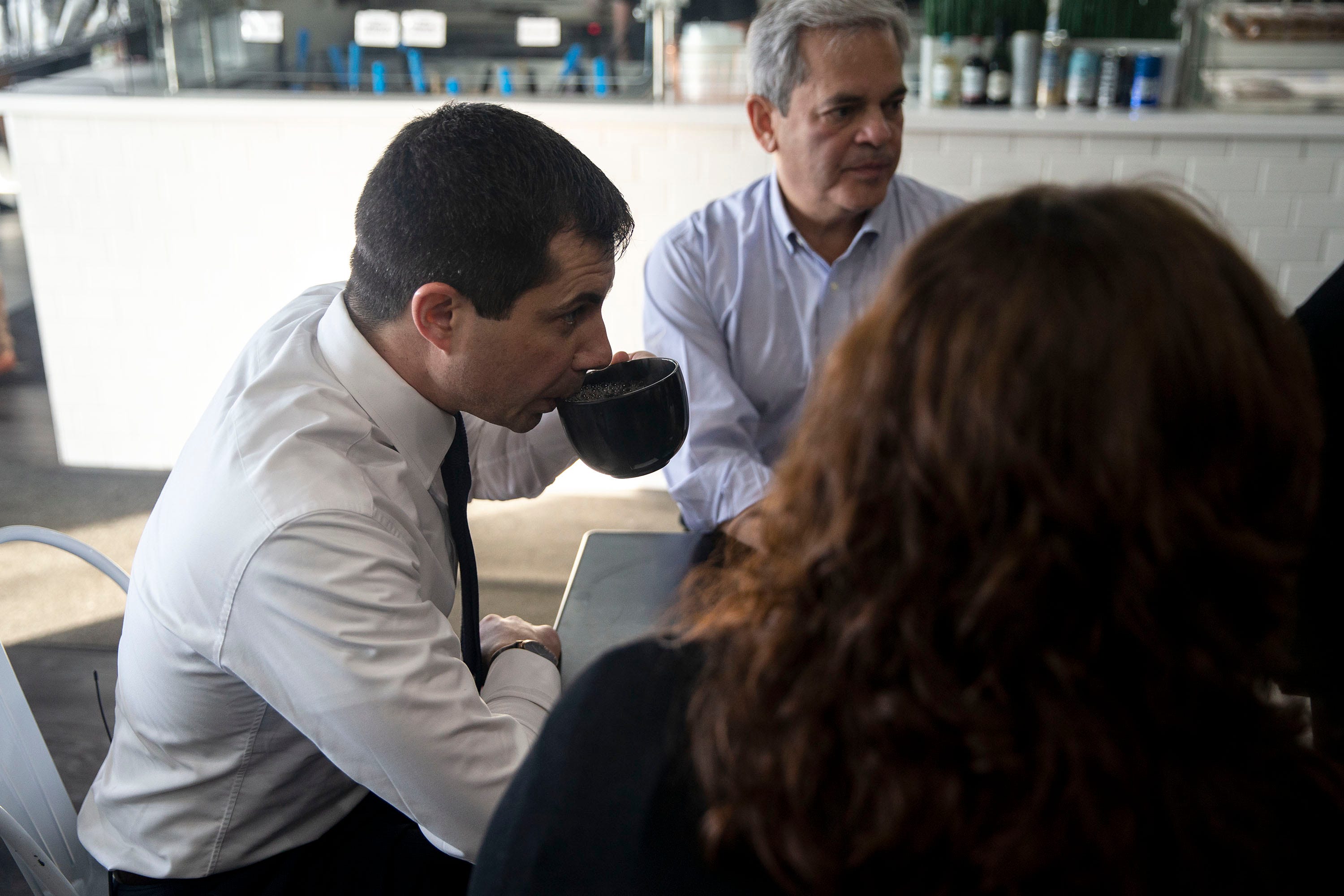 9:39 a.m., Clive — Pete Buttigieg sips on his coffee while meeting with a group of mayors in Iowa campaigning for him: Austin, Texas, Mayor Steve Adler; Parkland, Florida, Mayor Christine Hunschofsky; and Lincoln, Nebraska, Mayor Leirion Gaylor Baird.