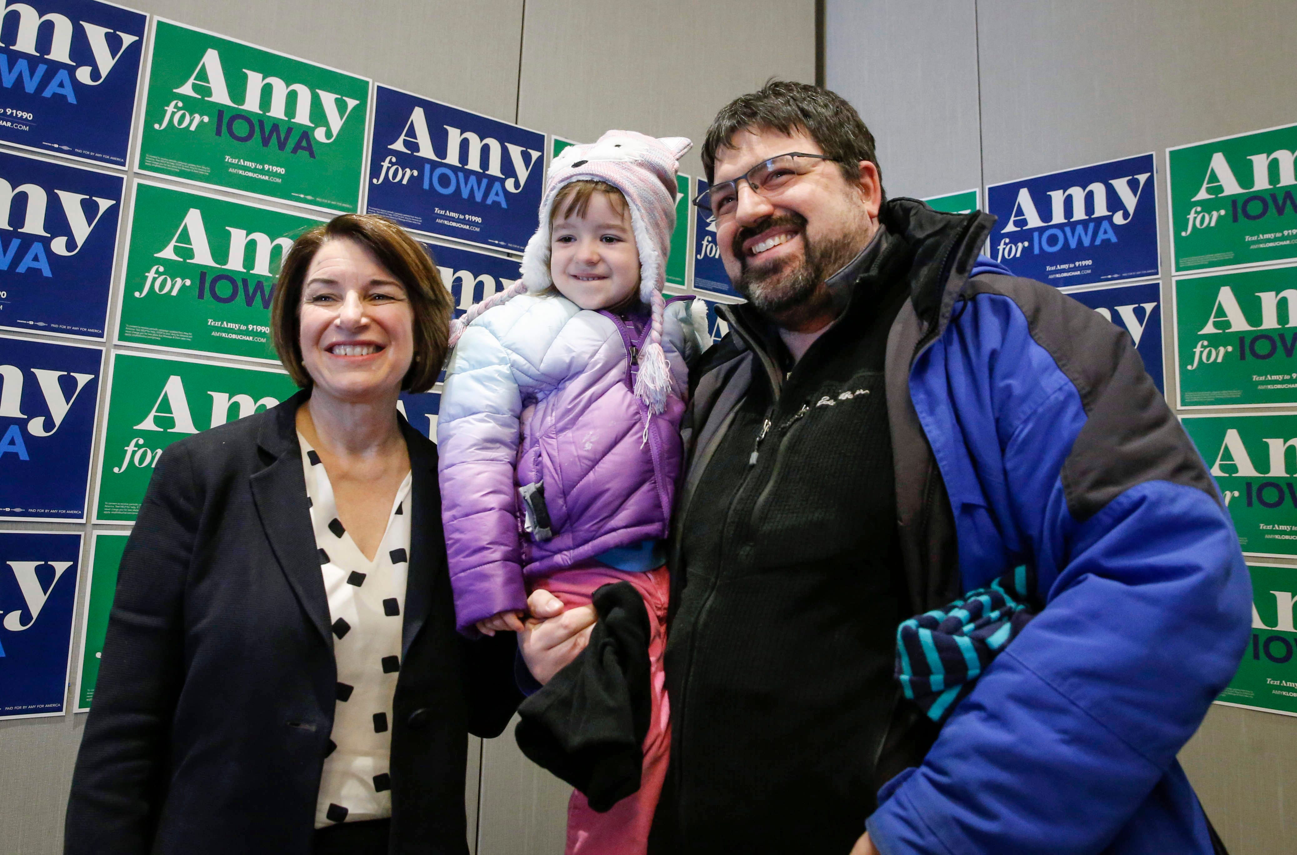 BRYON 1:29 p.m., Coralville -- U.S. Sen. Amy Klobuchar poses for a photo with Adam Schwalje and his four-year-old daughter, Clara, of Coralville after Amy spoke to a crowded room of supporters at the Marriott Hotel in Coralville.