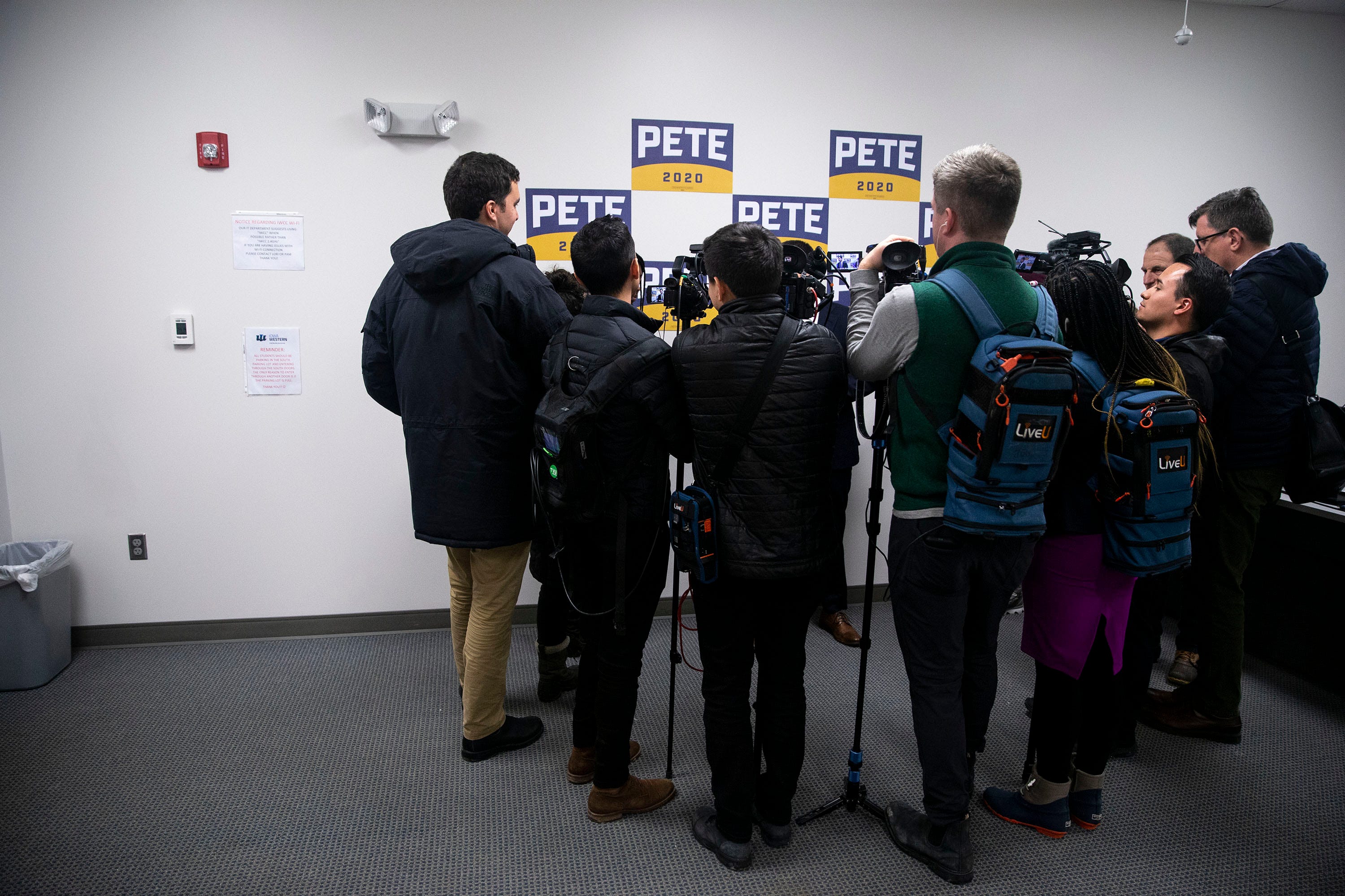 3:51 p.m., Harlan — Pete Buttigieg talks to the media after a town hall. He is asked about the latest back-and-forth between some of his rivals, but he declines to comment on it.