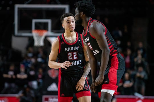 UL freshman guard Calvin Temple (left, 22) has entered the NCAA transfer portal, but big man Dou Gueye (right) is expected to return for the Ragin' Cajuns for 2020-21.