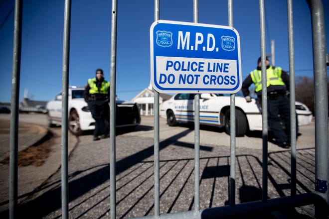 Memphis Police stand behind barricades Sunday, Jan. 19, 2020, near Holy City Church of God in Christ church in Memphis. MPD is buying new equipment that will let it access cell phones without permission.