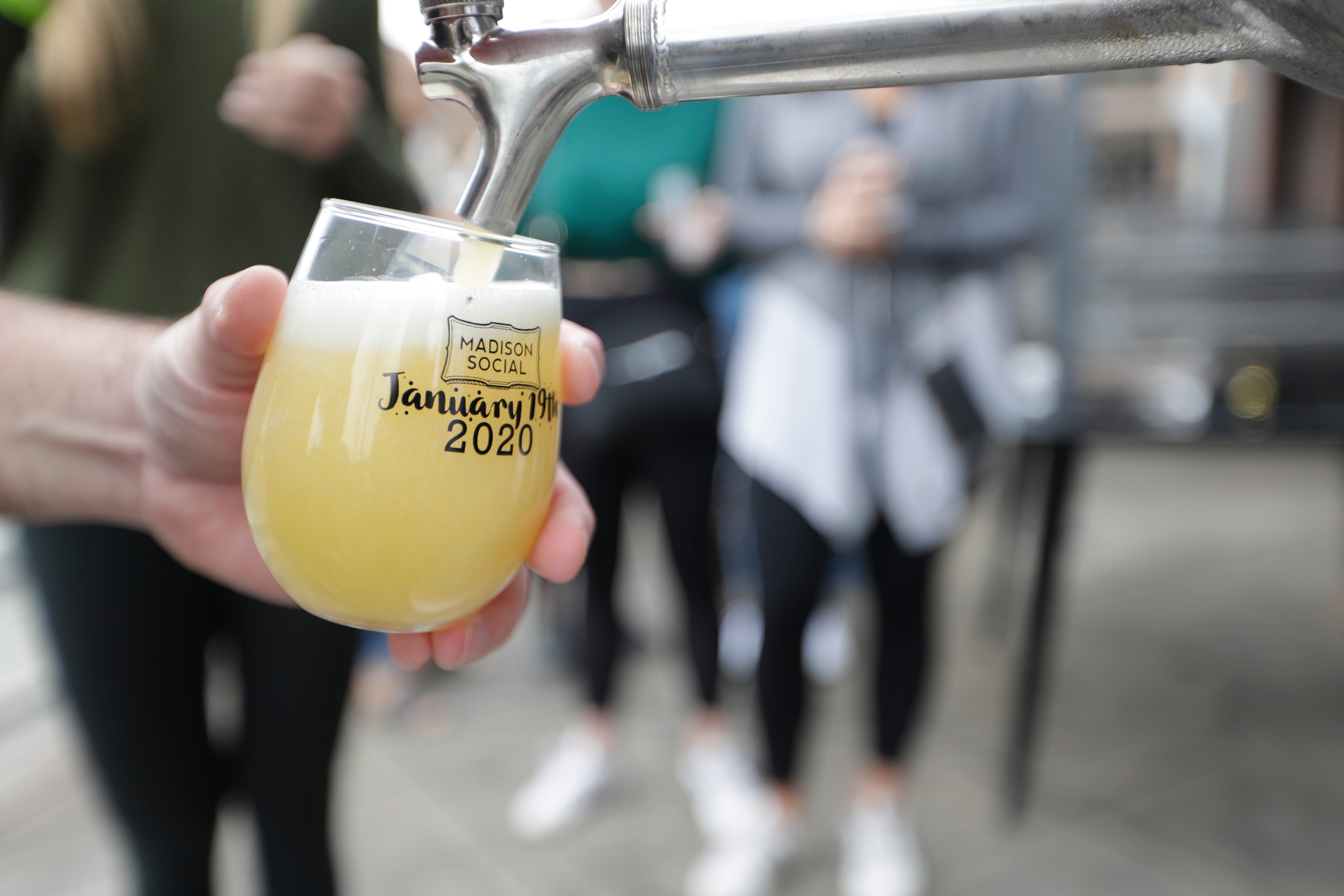 Madison Social Owner Matt Thompson pours out the first glass of the 3,000-ounce "Tallahassee's largest mimosa," the unofficial world record, at the CollegeTown bar Sunday, Jan. 19, 2020. 