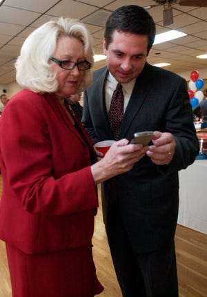 In this file photo, Connie Conway, candidate for State Assembly and Devin Nunes-R, 21st Congressional District, check election results at their election night party at the PPAV Hall on Tuesday, Nov. 4, 2008. They both won their elections.