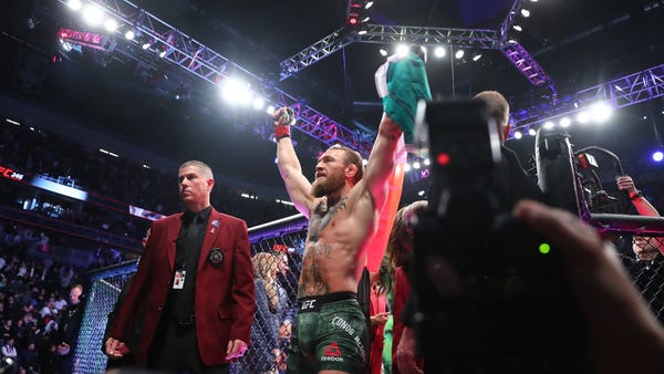 Conor McGregor celebrates his TKO victory against 