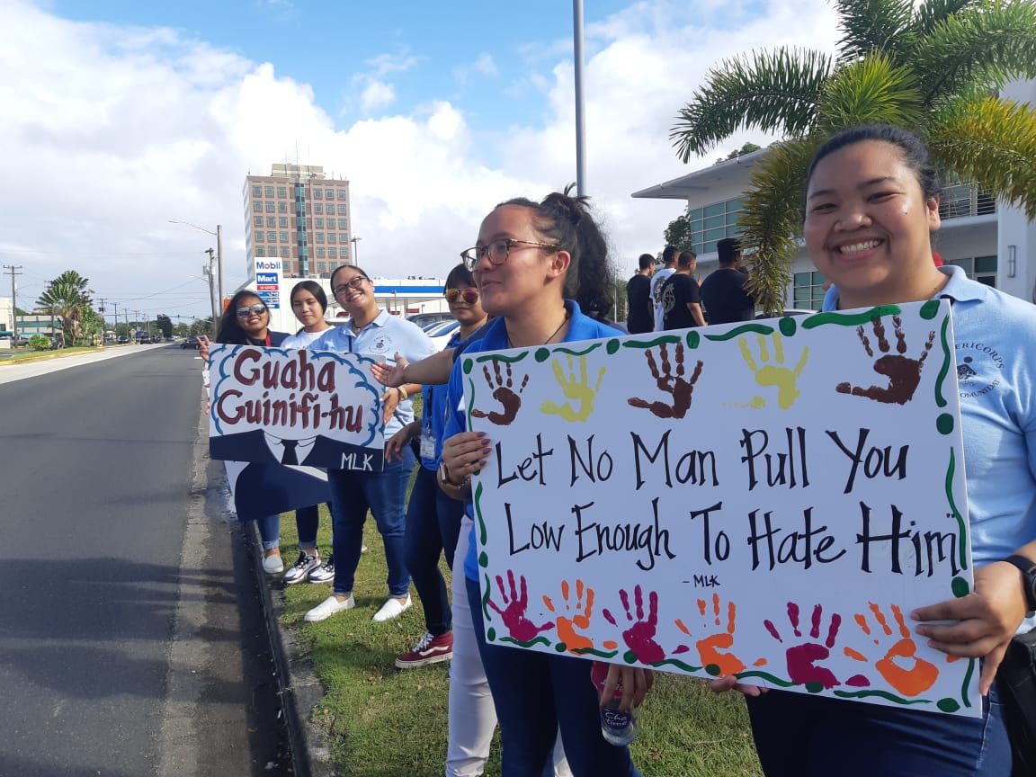 AmeriCorps members participate in a wave to celebrate Martin Luther King Jr. Day in Hagåtña in this Jan. 20 file photo.