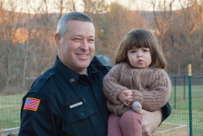 Officer Kevin Martyn visits Willa Splurgin days after he came into her home to perform life-saving CPR on the 2-year-old.