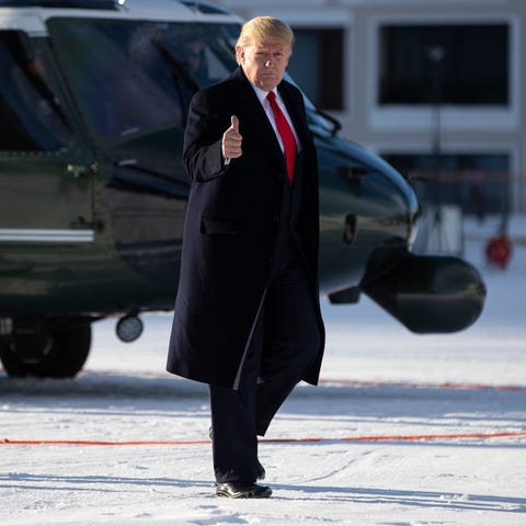 President Donald Trump gestures as he arrives in D