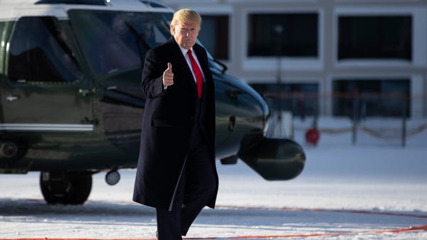President Donald Trump gestures as he arrives in D