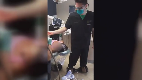 A dentist who shared video that shows him extracti