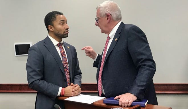 State Sen. Adam Hollier, D-Detroit, left, talks with U.S. Rep. Paul Mitchell, R-Dryen, after a committee hearing in Lansing on Wednesday,  Jan. 22, 2020. Mitchell spoke in opposition to Hollier's bill that would limit local governments' ability to block mining operations.