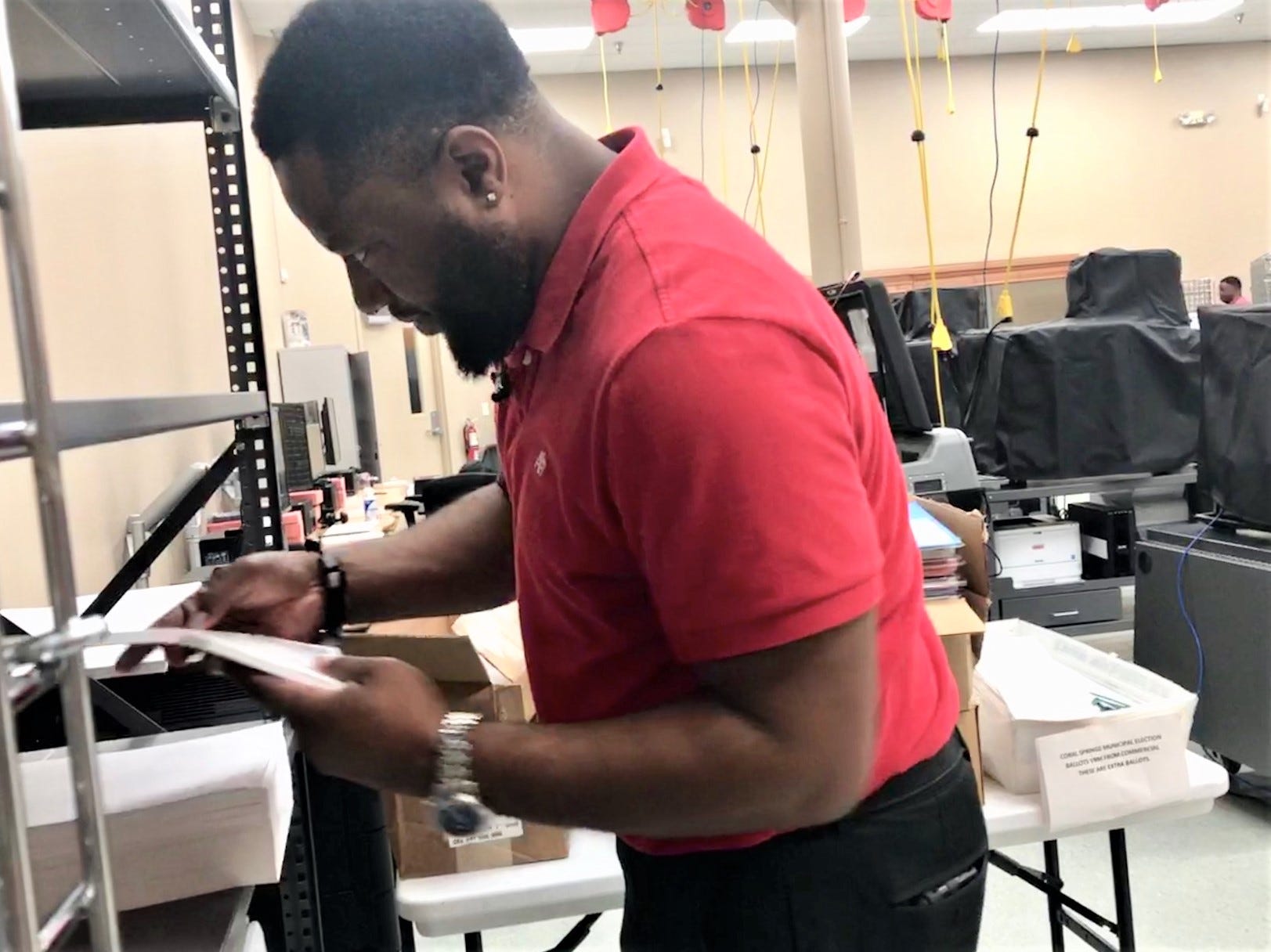 Broward County elections systems manager Kevron Aird prepares the tabulation room in Lauderhill on Wednesday, Oct. 16, 2019, before a mock election.