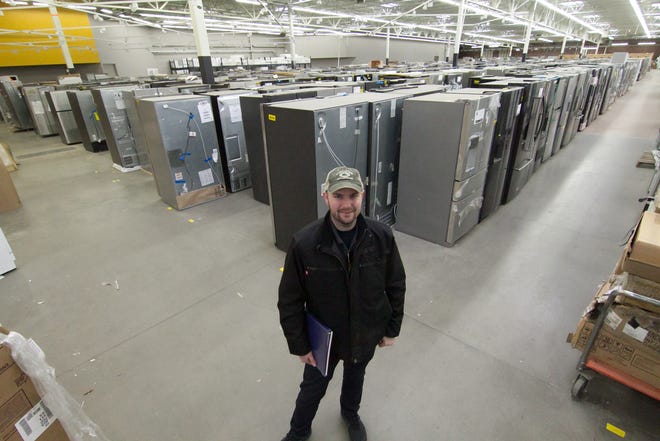 Noble Appliance co-owner Jeremiah Miller stands inside in part of a former Walmart in Hartland Township Wednesday, Jan. 22, 2020. The company is gearing up to open a new store that will also serve as its new headquarters.