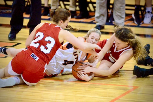 Port Huron's Morgan James and Madison Gilbert scrap for a loose ball against Utica in a Macomb Area Conference-Silver girls basketball game on Tuesday, Jan. 21, 2020.