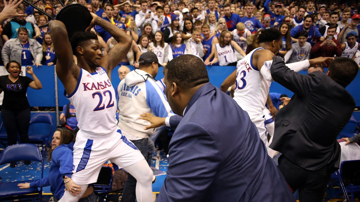 Kansas' Silvio De Sousa picks up a chair during a brawl with Kansas State.