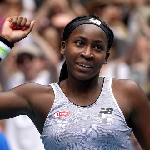 Coco Gauff celebrates after defeating Romania's So