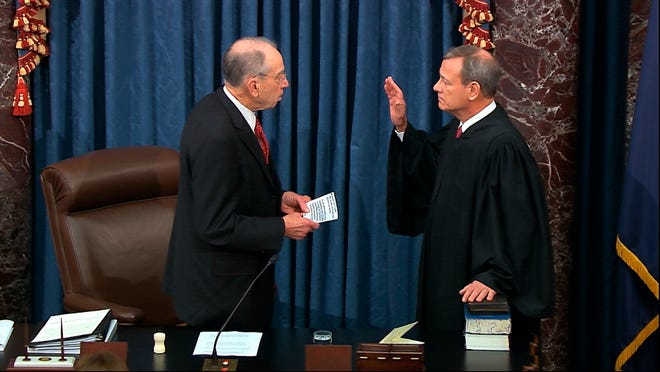 In this image from video, President Pro Tempore of the Senate Sen. Chuck Grassley, R-Iowa., swears in Supreme Court Chief Justice John Roberts as the presiding officer for the impeachment trial of President Donald Trump in the Senate at the U.S. Capitol in Washington, Jan. 16, 2020.