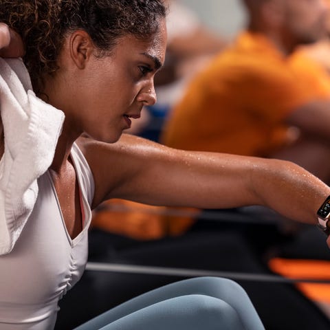 A woman works out with her Apple Watch at Orangeth