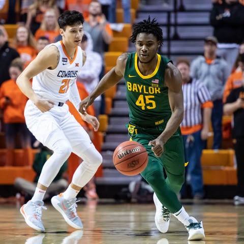 Baylor guard Davion Mitchell dribbles past Oklahom