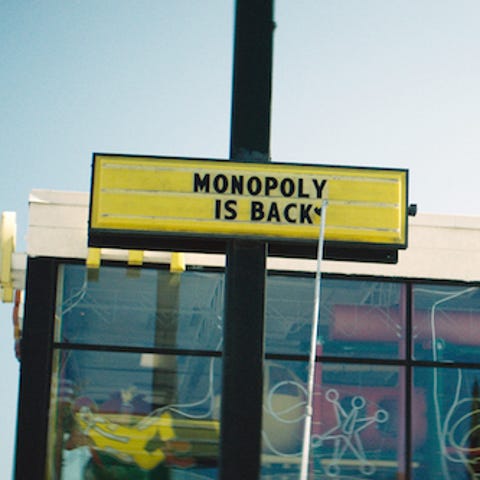 A marquee announces the return of McDonald's Monop