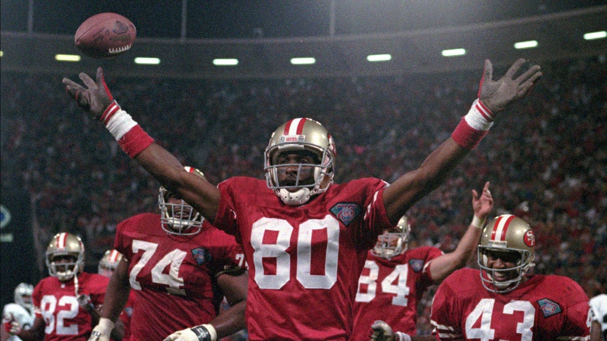 San Francisco 49ers wide receiver Jerry Rice celebrates after setting the all-time touchdown record during the fourth quarter against the Los Angeles Raiders at Candlestick Park in San Francisco, Monday Sept. 5, 1994.