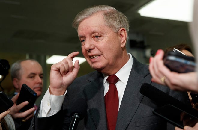 Sen. Lindsey Graham, R-S.C., speaks to the media before attending the impeachment trial of President Donald Trump on charges of abuse of power and obstruction of Congress, Thursday, Jan. 23, 2020, on Capitol Hill in Washington. (AP Photo/ Jacquelyn Martin) ORG XMIT: DCJM104