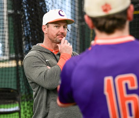 Clemson head coach Monte Lee talks with Clemson junior Bo Majkowski(16) during the first official team Spring practice at Doug Kingsmore Stadium in Clemson Friday, January 24, 2020.